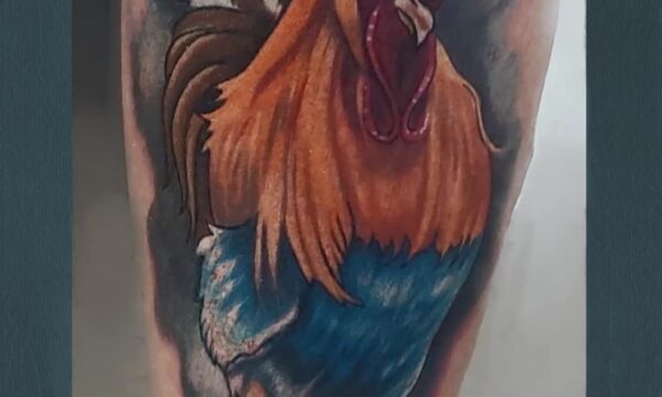 Loretta Thomason Color rooster tattoo