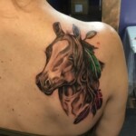 Les Hayes horse and feather tattoo Les Hayes horse and feather tattoo