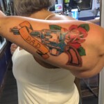Les Hayes traditional gun rose tattoo Les Hayes traditional gun rose tattoo